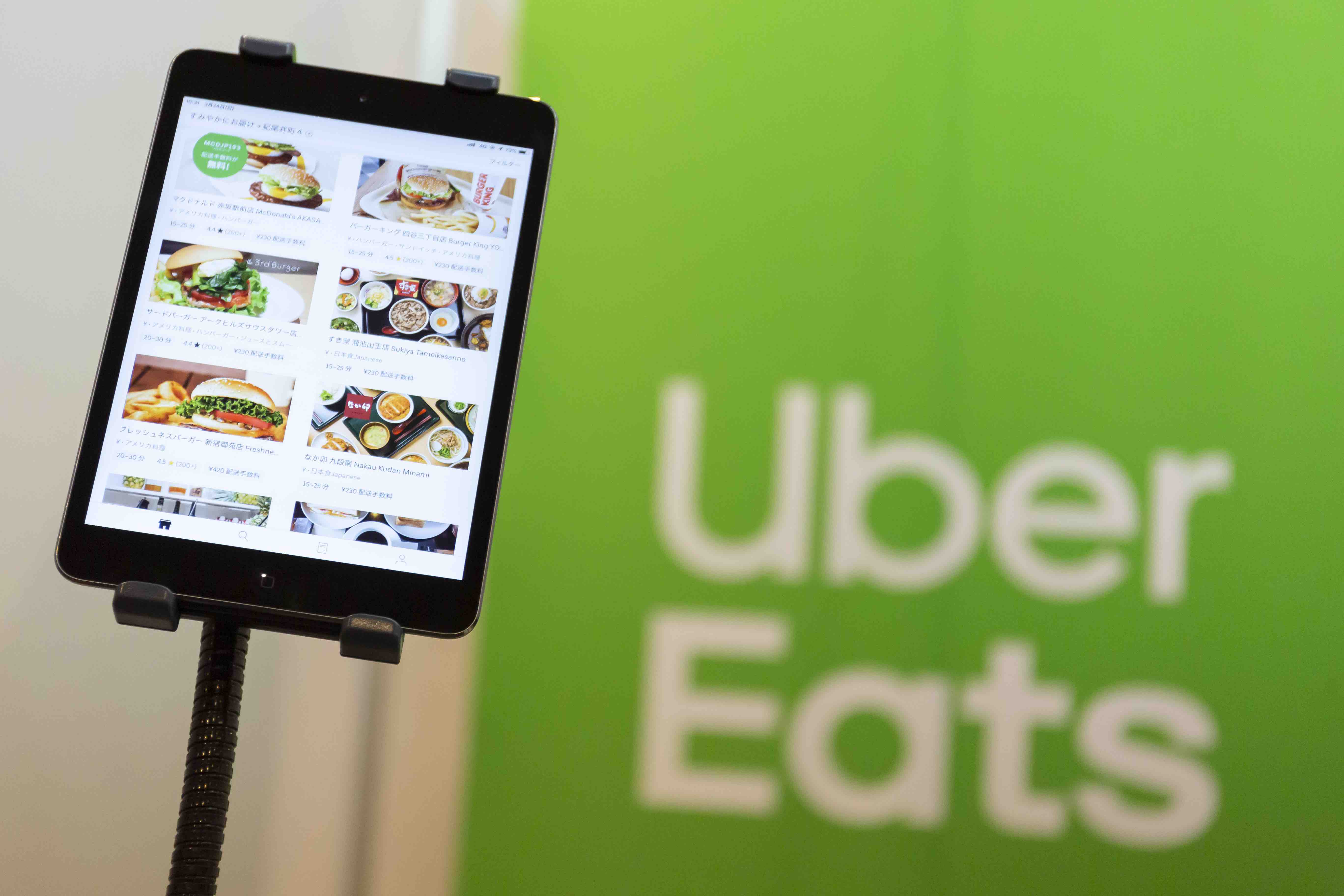 uber eats rideshare app on ipad for ordering food delivery